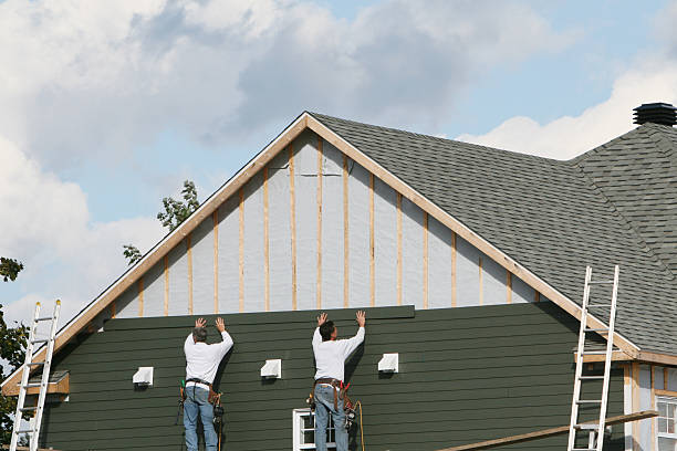 Professional Siding technician working in Deer Park, NY